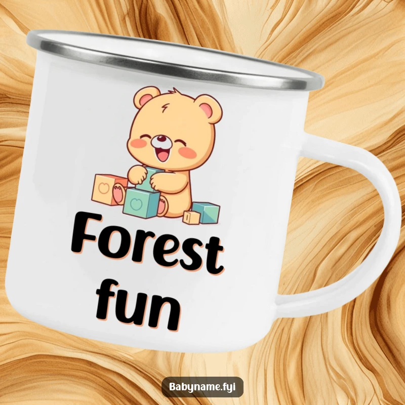 Funny camping mug featuring a tiny baby bear character giggling while playing with building blocks, perfect for enjoying drinks outdoors.