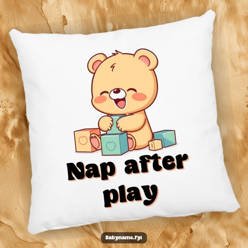 Funny pillow featuring a tiny baby bear character giggling uncontrollably while playing with building blocks, offering comfort with a side of humor.