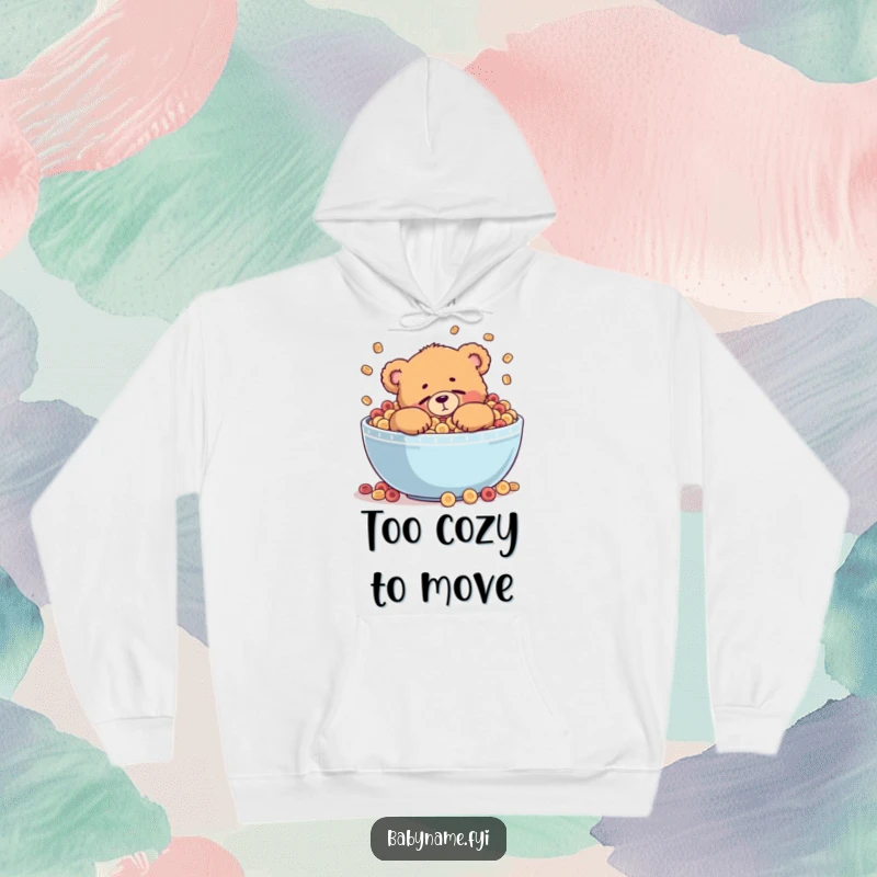 Funny hoodie with a chubby teddy bear character trying to sleep inside a giant, overflowing cereal bowl, perfect for loungewear.