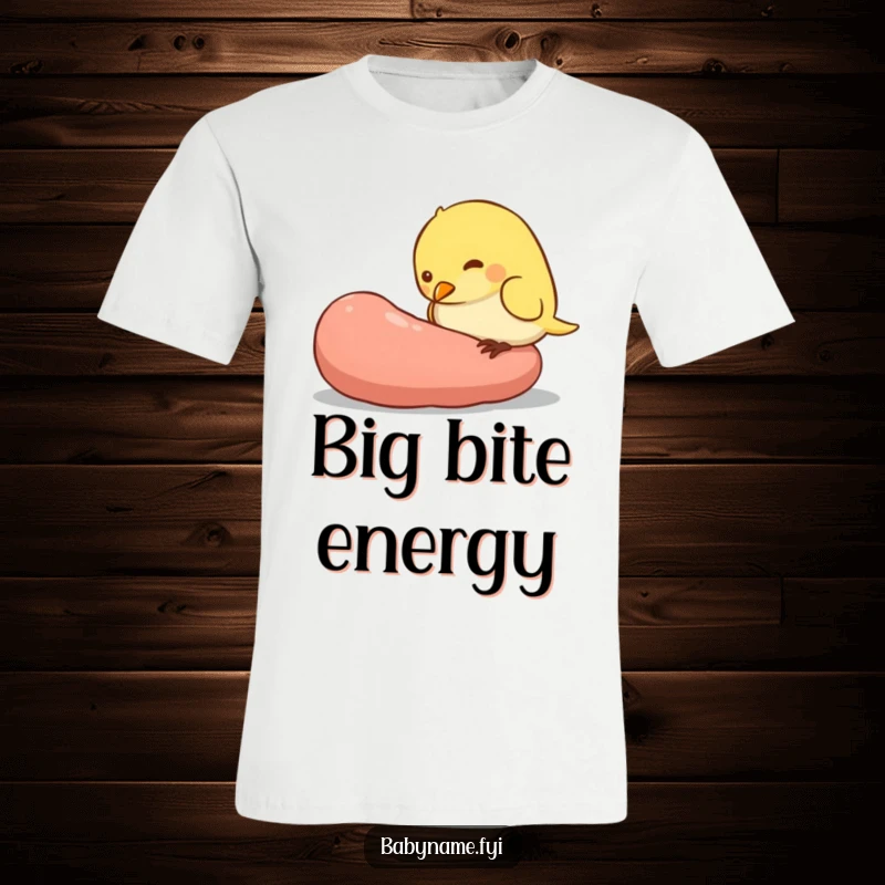 Funny t-shirt graphic of a cute, plump baby bird character aggressively pecking at a worm that is much larger than itself, highlighting its hunger.